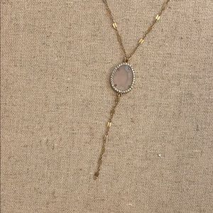 Beautiful gold necklace with pink faceted stone